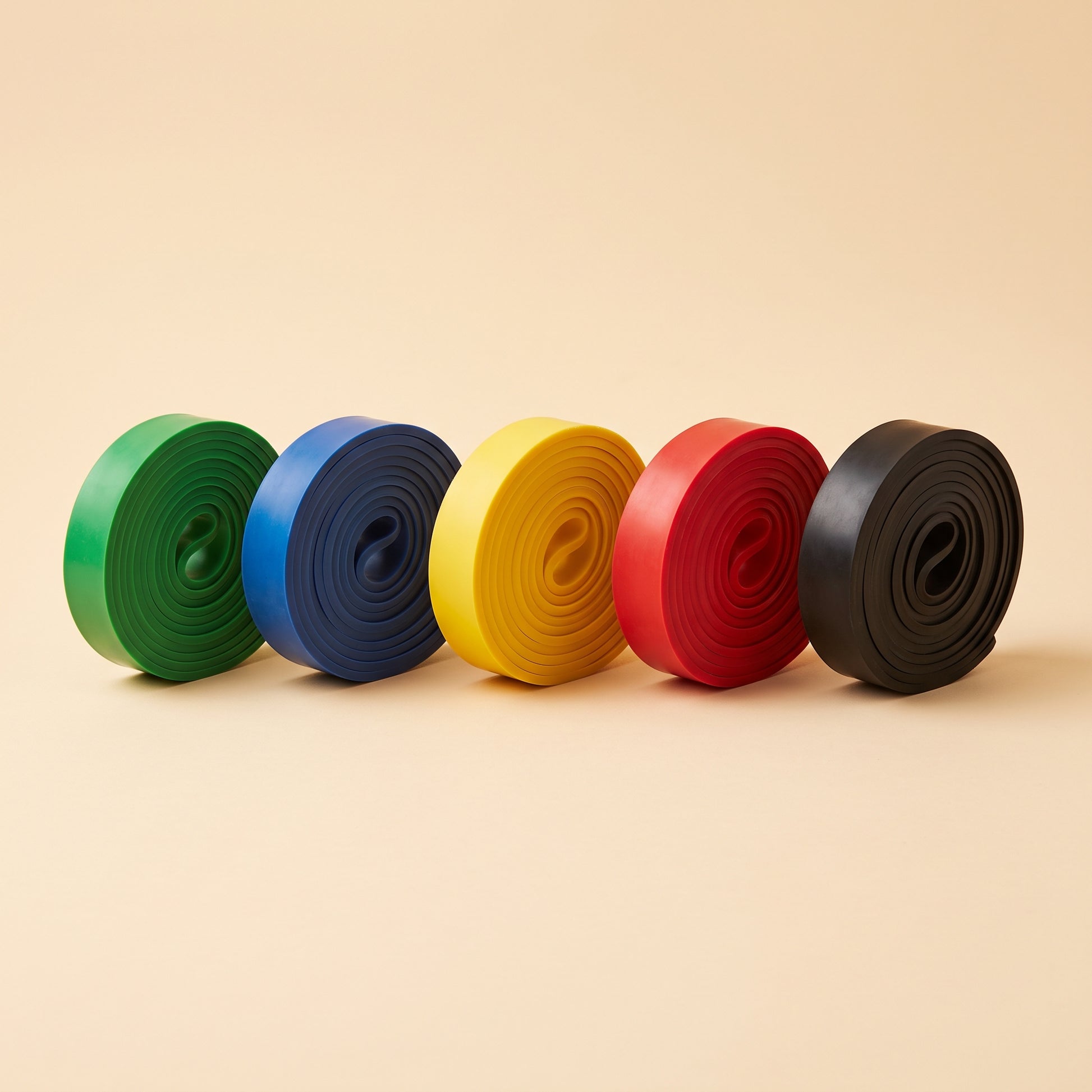 CurveOn Booty Bands — five bands coiled neatly in a row