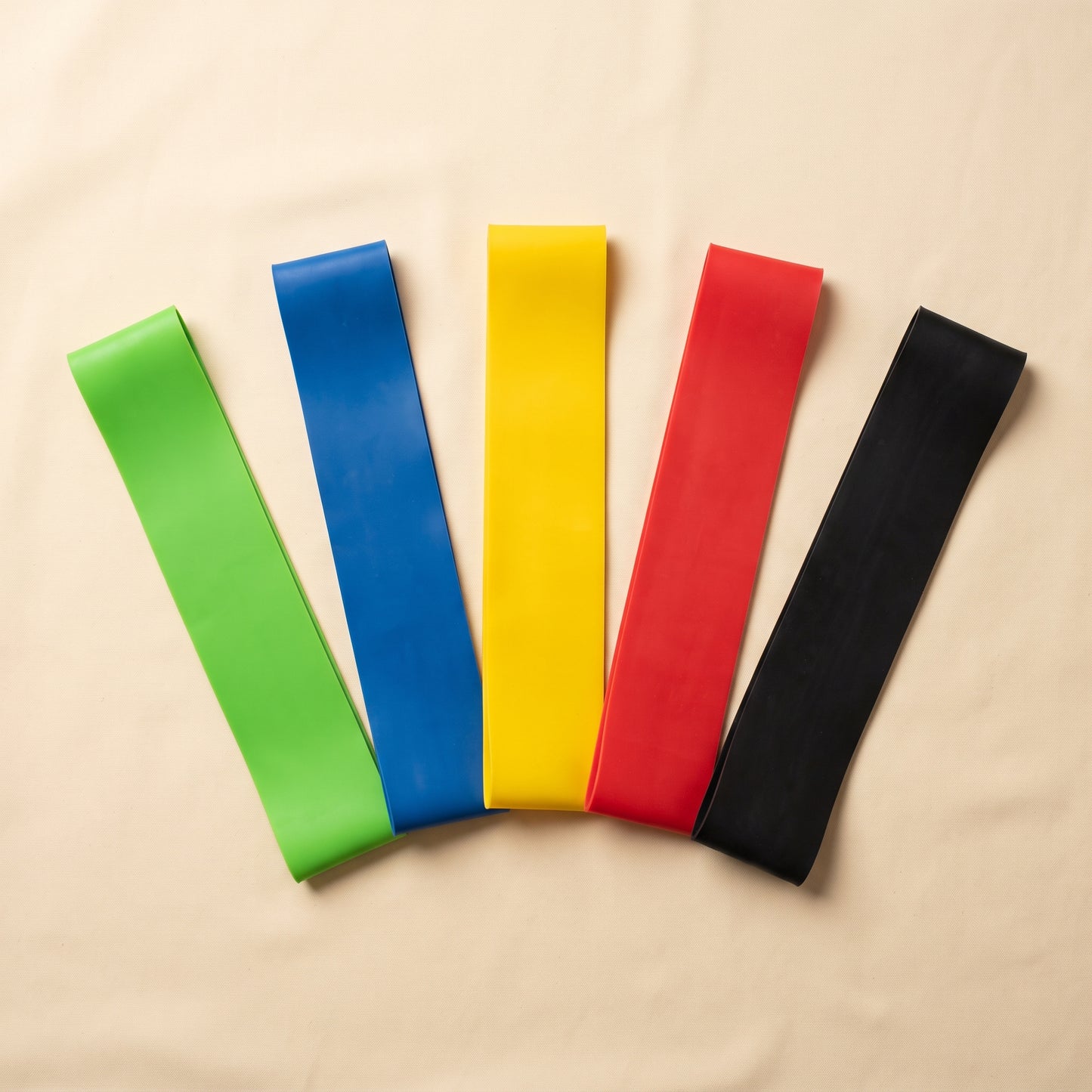 CurveOn Booty Bands — full set of 5 resistance loop bands (green, blue, yellow, red, black) fanned out