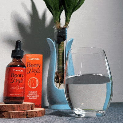 CurveOn Booty Drops bottle beside a morning glass of water
