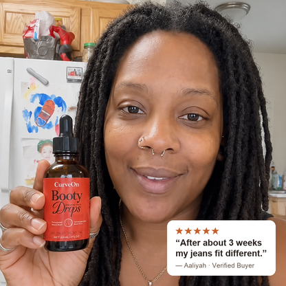 CurveOn customer holding her Booty Drops bottle - verified 5-star review